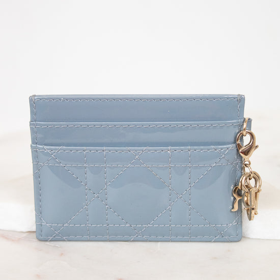 Light blue cardholder with a keychain on a white background