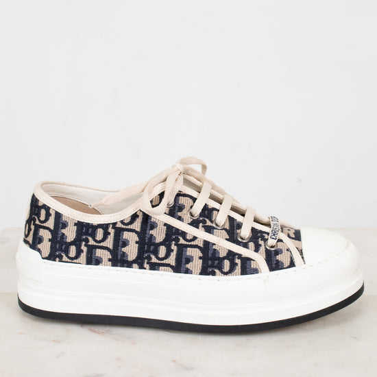 White sneaker with navy pattern on a white background