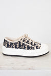White sneaker with navy pattern on a white background