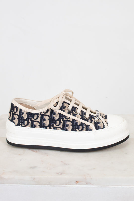 White sneaker with navy pattern on a white background