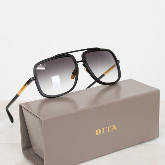 Dita sunglasses on a gray Dita case with a white background