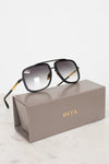 Dita sunglasses on a gray Dita case with a white background
