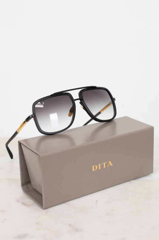 Dita sunglasses on a gray Dita case with a white background