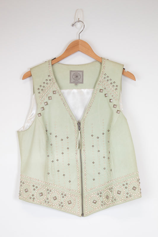 Light green vest with intricate studded patterns on a hanger against a white background