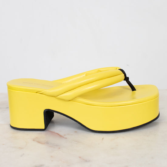 Yellow platform sandal on a light gray background