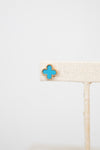 Turquoise floral shaped earring on a white background
