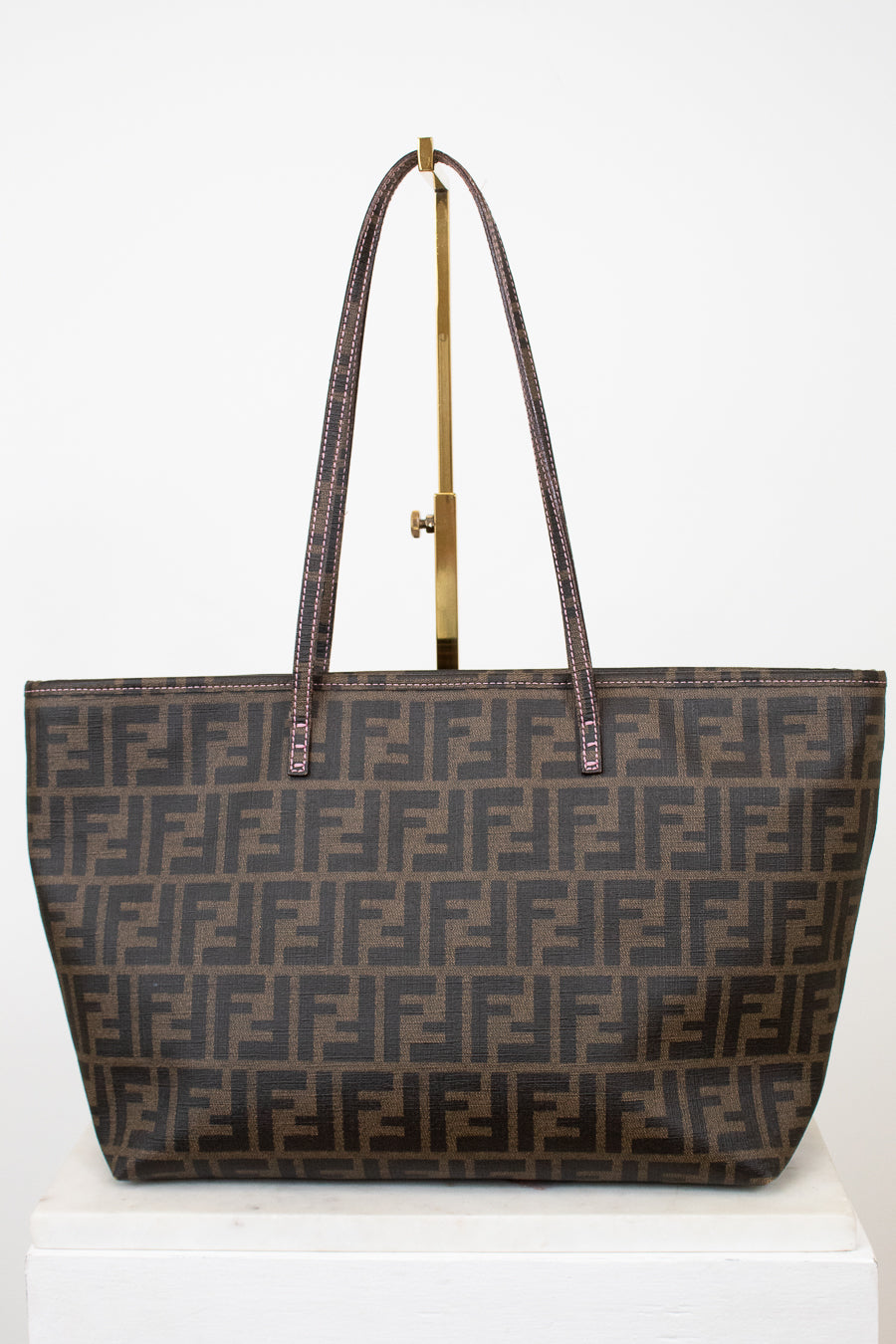 Fendi handbag with a prominent FF logo on a white background