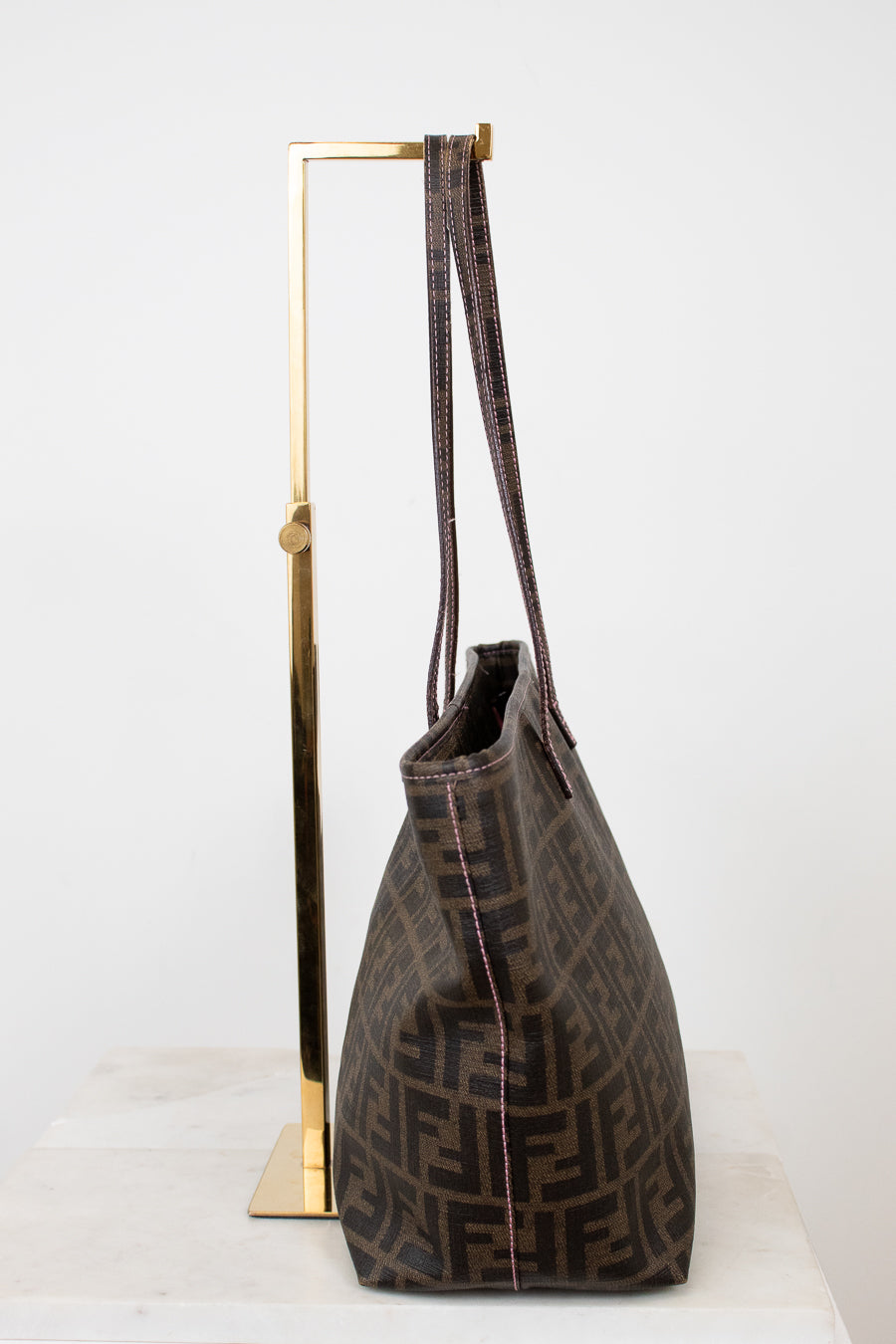 Fendi handbag with a prominent FF logo on a white background