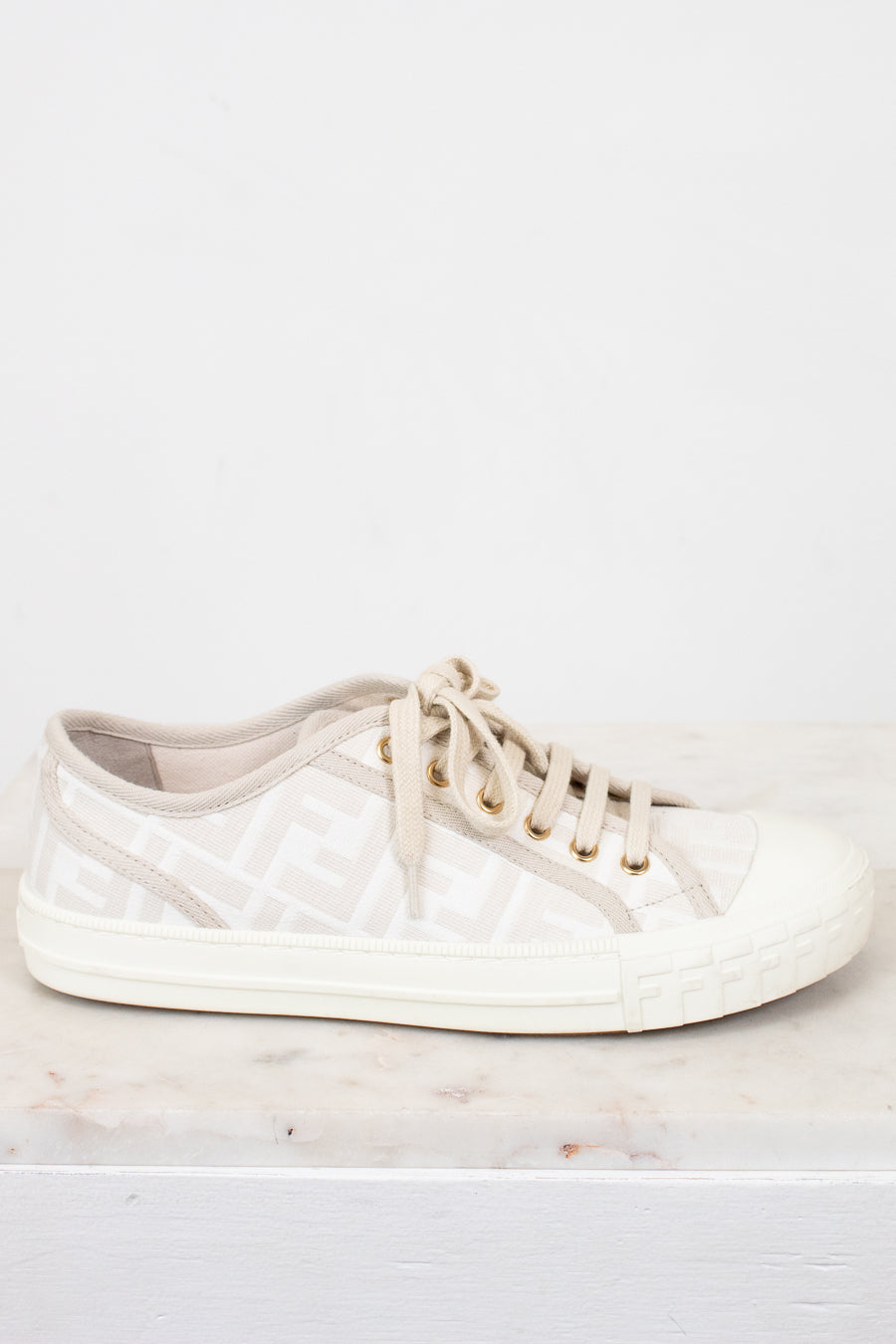 White sneaker on a light gray surface