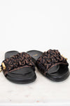 Pair of black slides with Zucca print straps on a white background