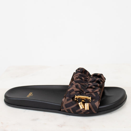Zucca print sandal with a black slide on a white background