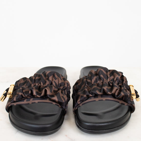 Pair of sandals with Zucca print straps on a white background