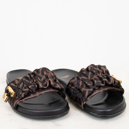 Pair of sandals with zucca print straps on a white background