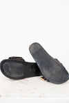Bottom black sandal sole on a white background