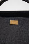 Black handbag with a gold Fendi logo on a white background