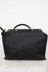 Black handbag with gold accents on a white background