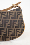 Brown handbag with black logo pattern on a white background