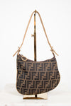 Designer handbag with a distinctive pattern on a white background
