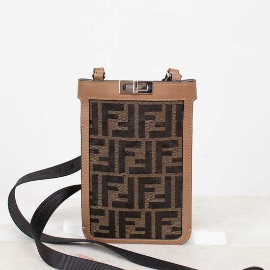 Phone case with FF logo and strap on a white background