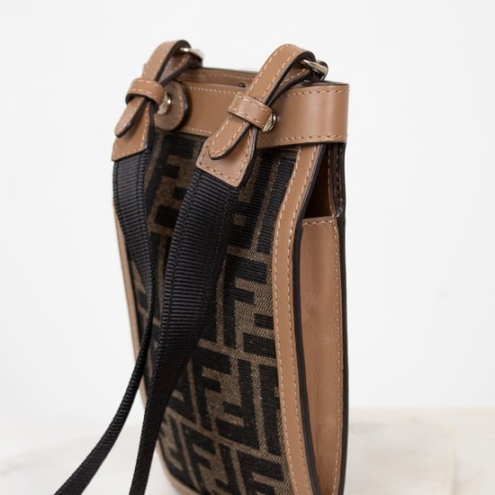 Designer handbag with a distinctive pattern on a white background