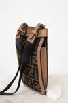 Designer handbag with a distinctive pattern on a white background