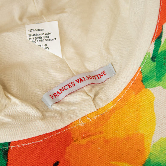 Cream hat interior with colorful edge and "Frances Valentine" tag