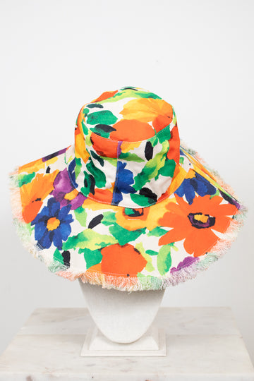 Colorful floral bucket hat with fringe on a white background