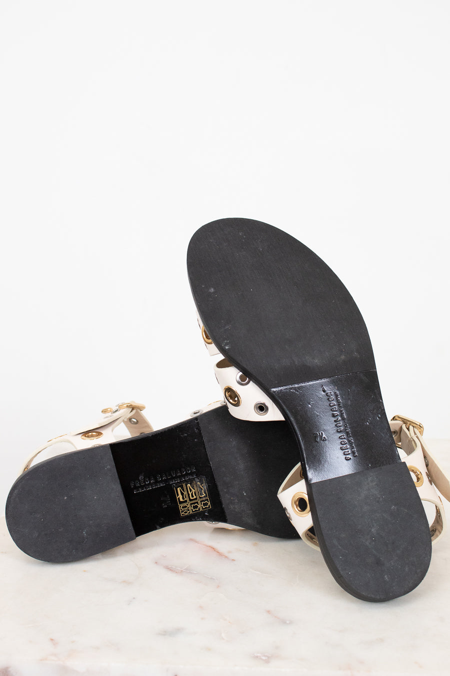 Black sandal sole with brand name on a white background