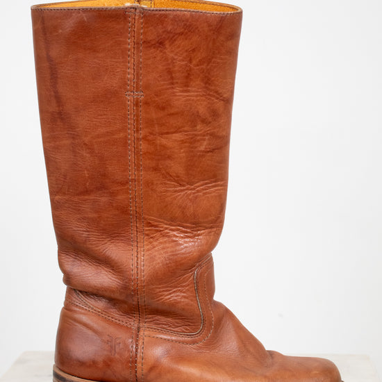 Brown leather boot on a white background