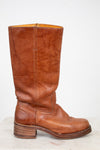 Brown leather boot on a white background
