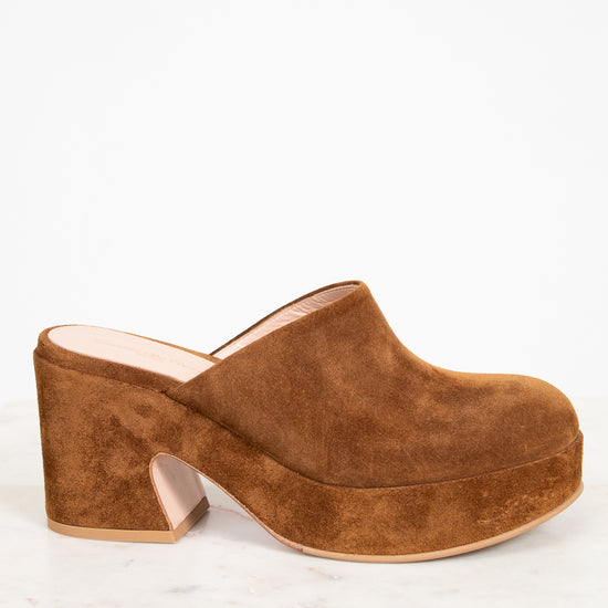 Brown suede clog shoe on a white background