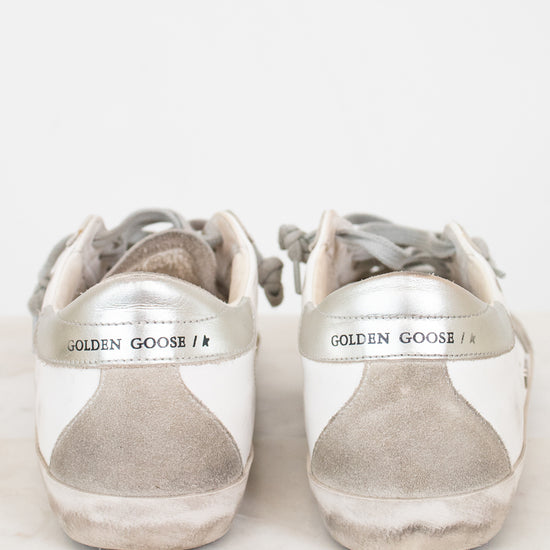 Pair of Golden Goose sneakers on a white background