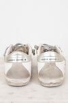 Pair of Golden Goose sneakers on a white background