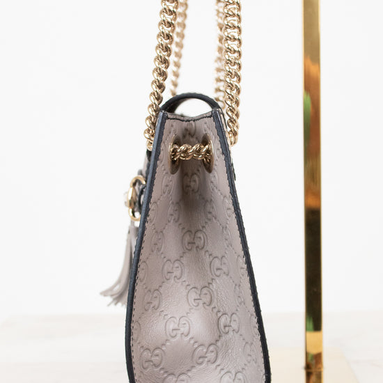 Gucci handbag with chain strap on a white background