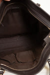 Close-up of a black handbag interior with visible stitching