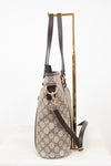 Designer handbag with monogram pattern on a white background
