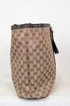 Beige and brown patterned bag with black accents on a white background