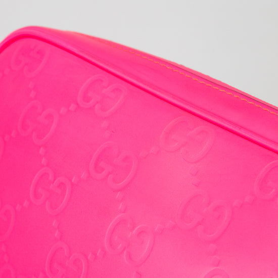 Close-up of a pink Gucci crossbody with a white background