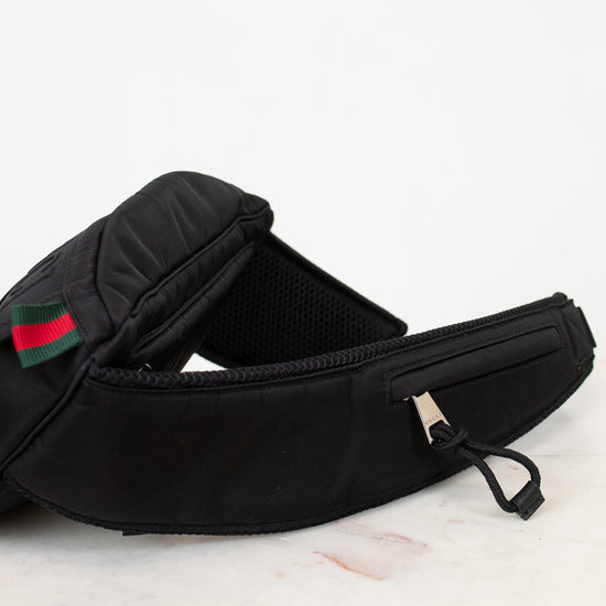 Black strap on sling bag on white background