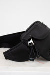 Black waist bag on a white background