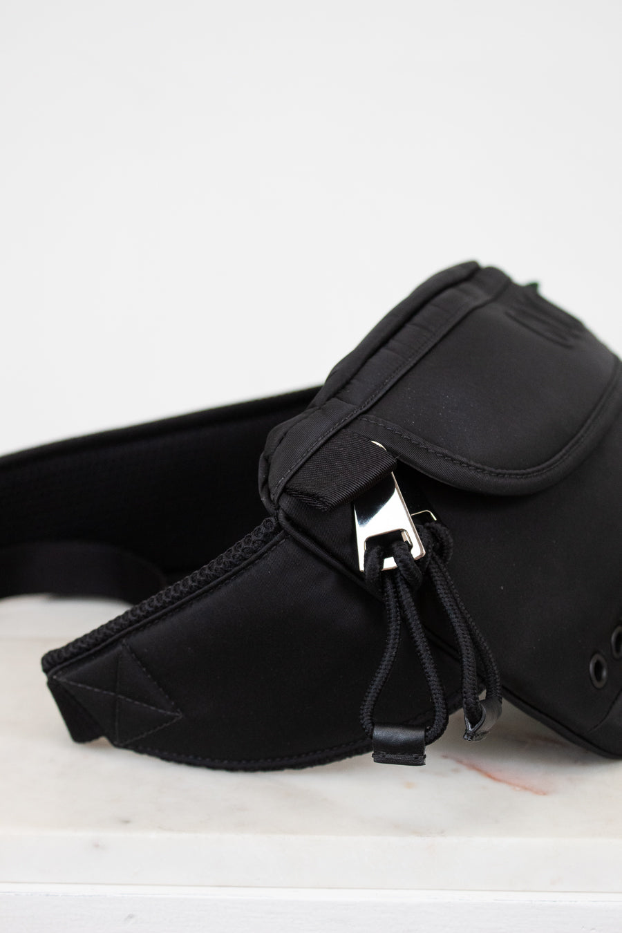 Black waist bag on a white background