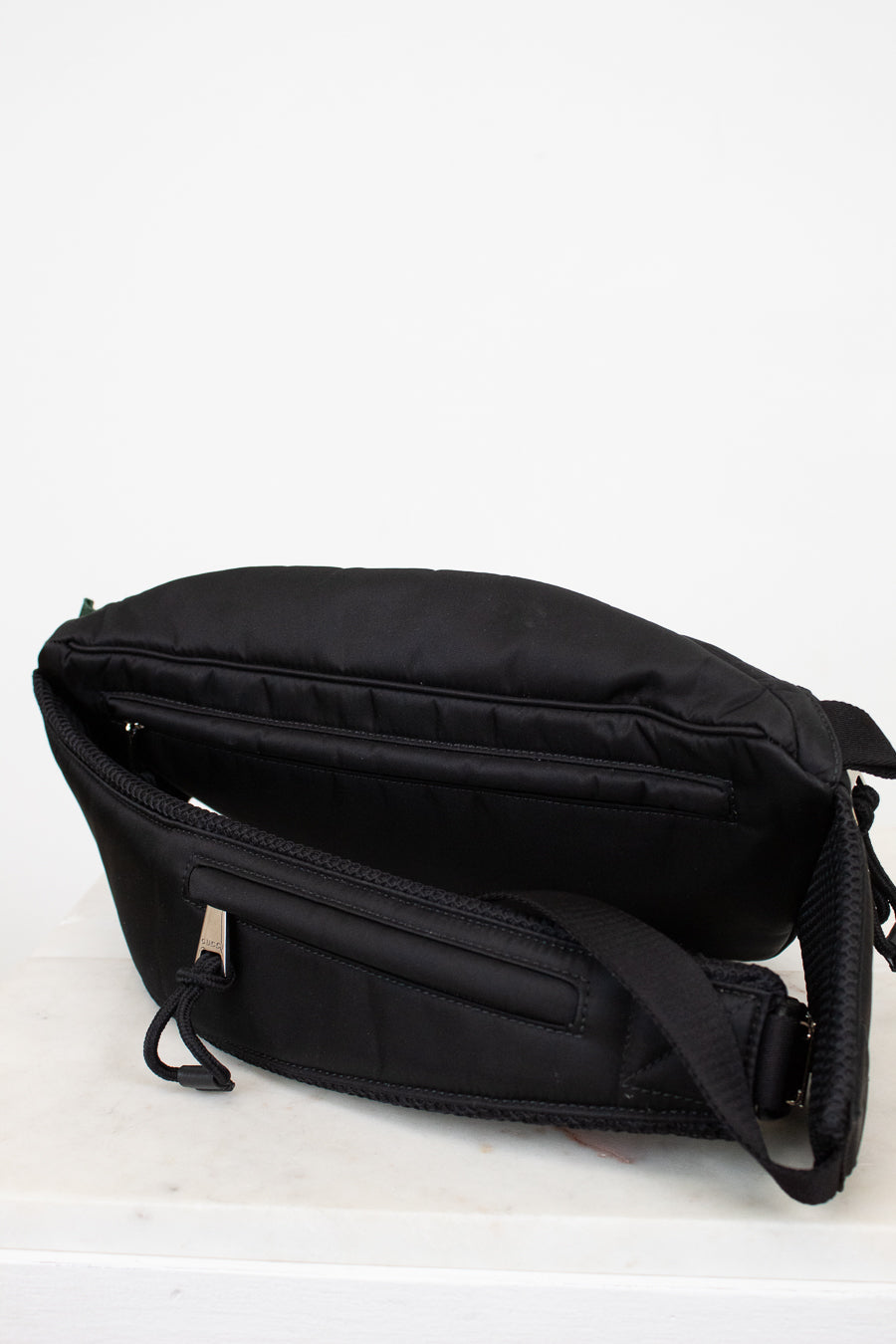 Black waist bag on a white background