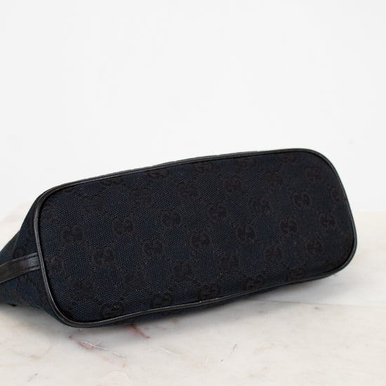 Bottom of black bag on a marble surface