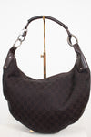 A dark brown Gucci hobo shoulder bag with the classic GG monogram canvas and dark brown leather trim, displayed on a stand against a white background.