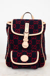 Backpack with Gucci monogram pattern on a white background