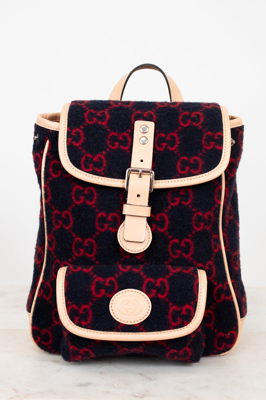 Backpack with Gucci monogram pattern on a white background