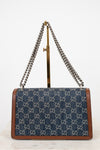 Designer handbag with chain strap on a white background
