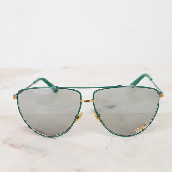 Front view of teal aviator sunglasses with gray lenses