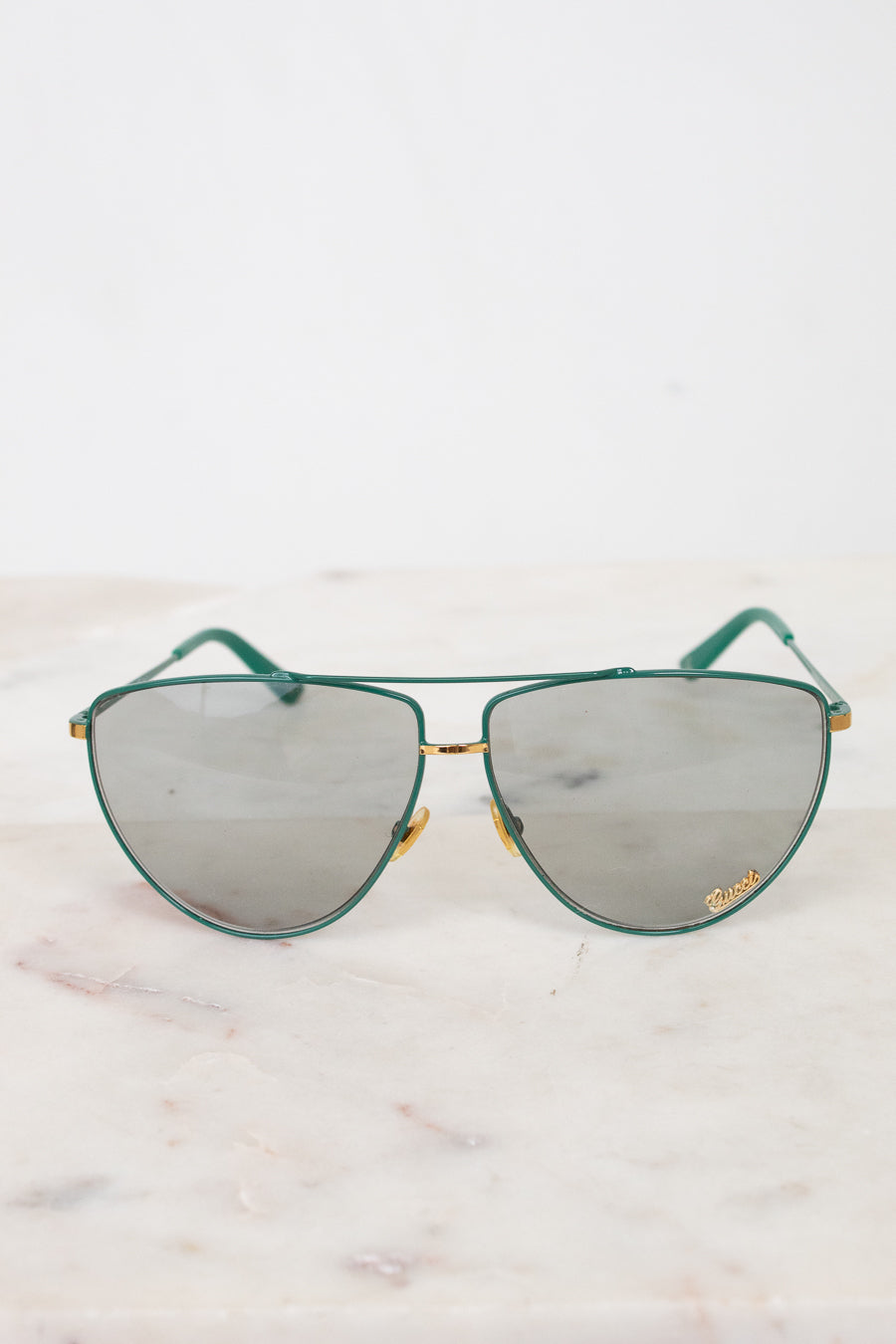 Front view of teal aviator sunglasses with gray lenses