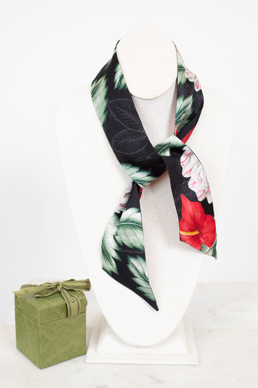 Scarf tied on white bust with green Gucci Box